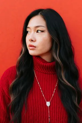 Pinned-up hair with blunt bangs to long caramel waves restyled
