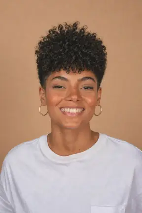 Big natural curls cut down to a short faded crop restyled