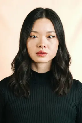 Blunt bangs grown out into center-parted waves restyled